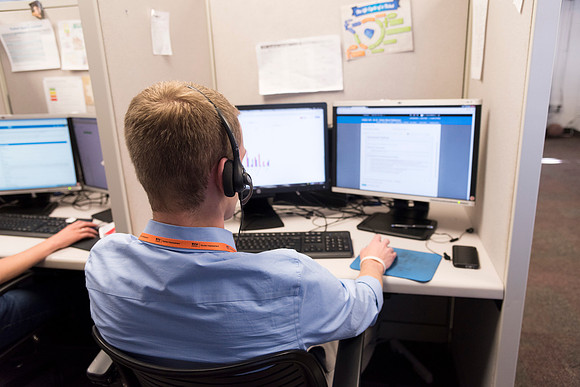 Employees work on developing a better curriculum for online students.