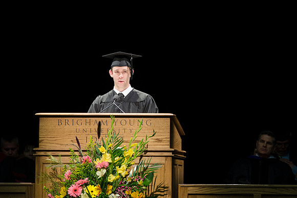Brett S. Philips, top 5 percent of graduating class, reads a scriptures during Convocation in the Hart Auditorium during the 2014 Winter Semester Graduation at BYU-Idaho.
