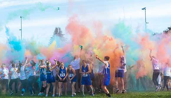Students participate in a color run around campus as part of Spirit Week.