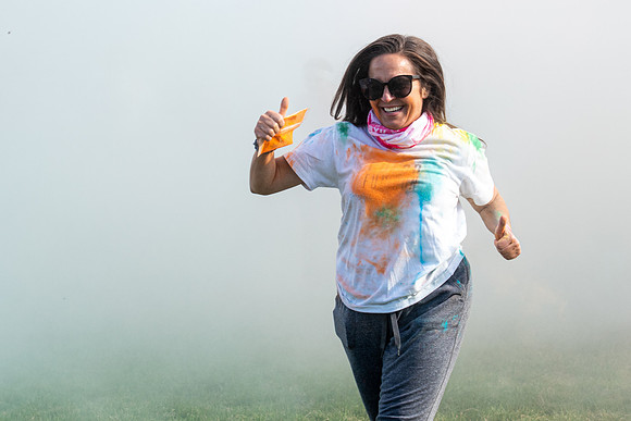 Students participate in a color run around campus as part of Spirit Week.