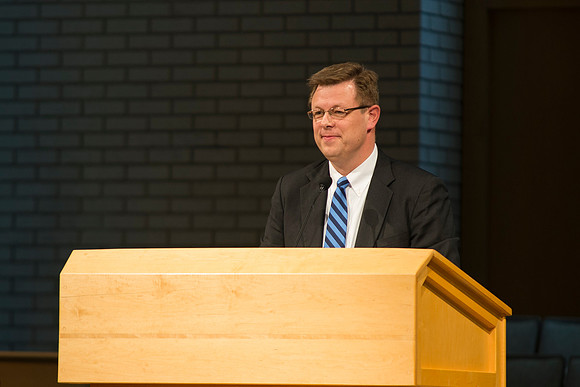 President Gilbert speaks to new students and their parents.