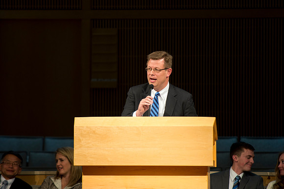 President Gilbert speaks to new students and their parents.