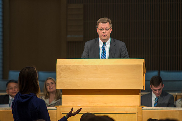 President Gilbert speaks to new students and their parents.