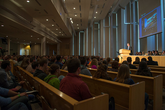 President Gilbert speaks to new students and their parents.