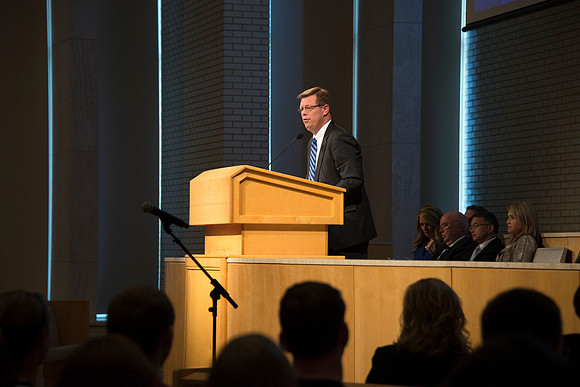President Gilbert speaks to new students and their parents.