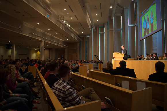 President Gilbert speaks to new students and their parents.