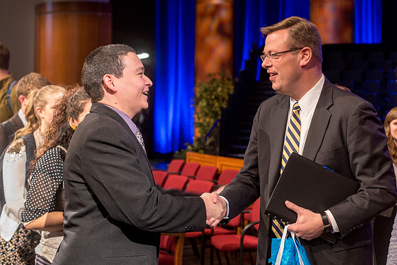 President Gilbert visits with Students after Devotional.