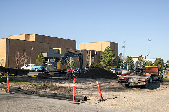 A construction team works on the new parking where Viking Village once stood.