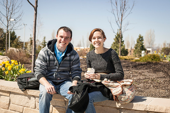 Two student hang out in the Taylor Quad on the first day of school during the Spring Semester.
