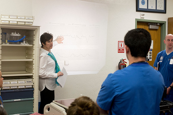 Sister Holly Forbush teaches students in the Nursing Lab.