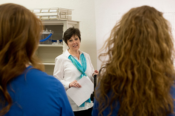 Sister Holly Forbush teaches students in the Nursing Lab.
