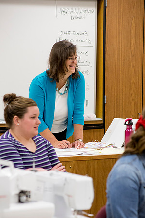 Sister Julann Blake listens as her students introduce themselves in her class.