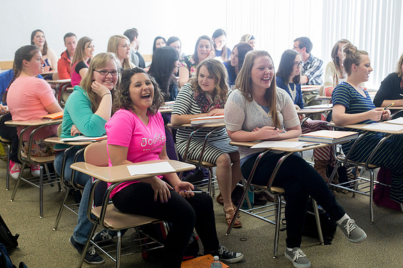 Students react to the surprise of having their picture taken.