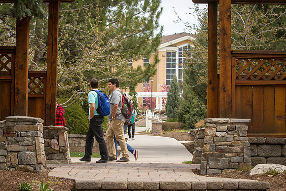Students pass through the gardens after class on the first week of school, during the 2015 Spring Semester.