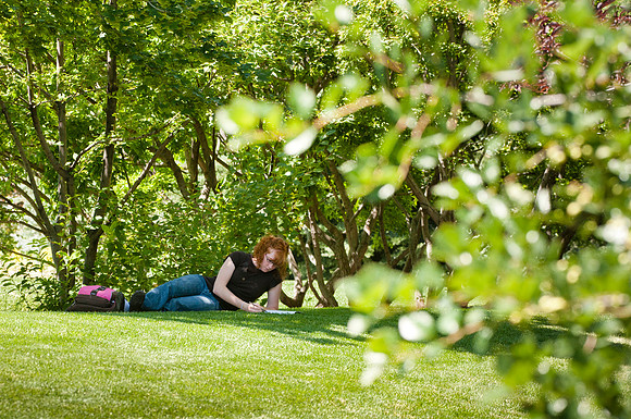 Student Michelle Crosby: reading/studying in the Ricks Garden