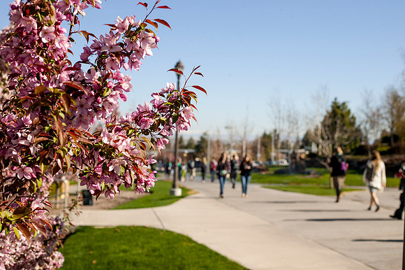 Students walk past the Hinckley Building as they walk to and from class.