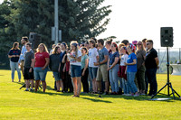 Students gather at the upper field for various 4th of July activities.