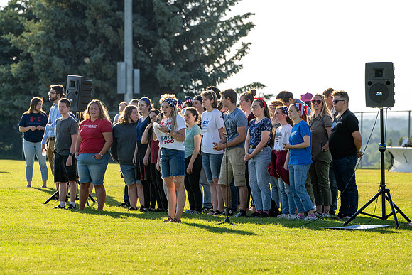 Students gather at the upper field for various 4th of July activities.