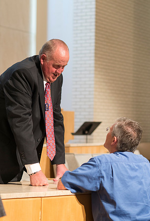 Devotional Speaker Garth Nelson is warmly greeted after his devotional talk.