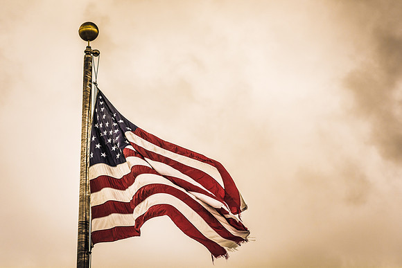 The American Flag in front of the Kimball Building.
