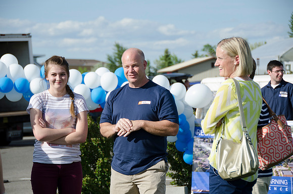 Online instructors gather with their families for an eveing of BBQ and games.