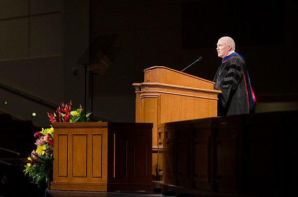 Richard J. Maynes, Presidency of the Seventy, addresses 2014 Winter Semester graduates during Commencement in the BYU-Idaho I-Center. Photo by Tyler Rickenbach