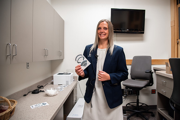 Ushers perform their duties in the I-Center to prepare for devotional. Used for an usher training video.