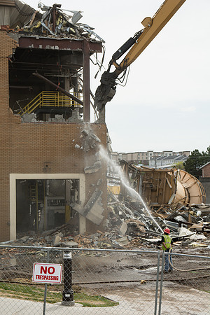 Workers continue the demolition process of the old Heating Plant.