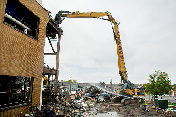 Workers continue the demolition process of the old Heating Plant.