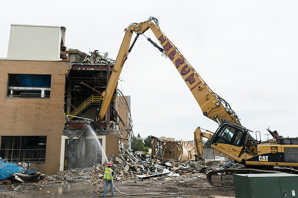 Workers continue the demolition process of the old Heating Plant.