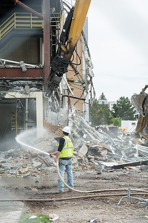 Workers continue the demolition process of the old Heating Plant.