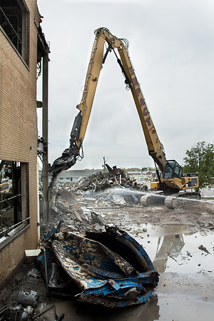 Workers continue the demolition process of the old Heating Plant.