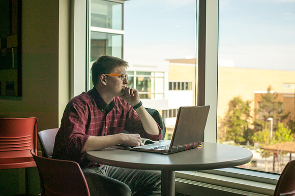 Andrew Greenman studies in the Crossroads on an early morning before class.