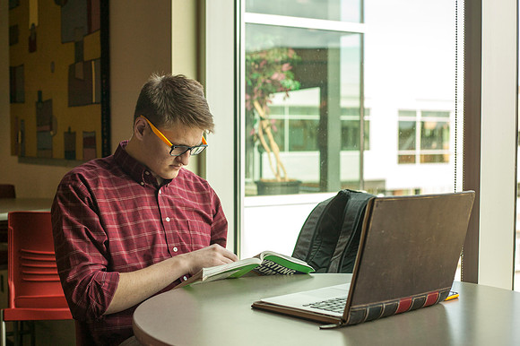 Andrew Greenman studies in the Crossroads on an early morning before class.