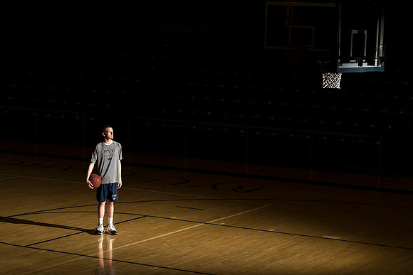 Casey Streeter looks up at the basketball hoop with aspiration.