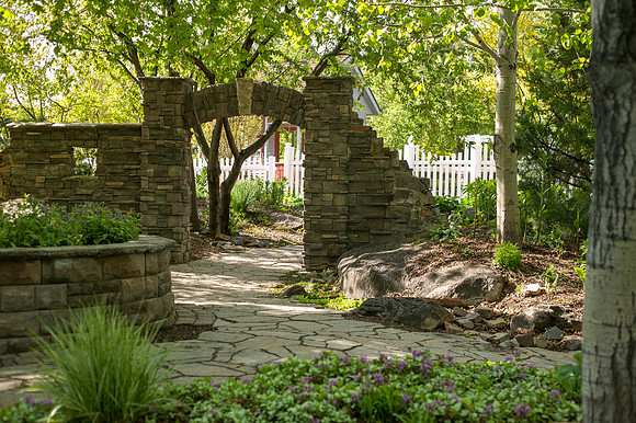 Light from the rising sun settles on a path in the Thomas E. Ricks Garden.