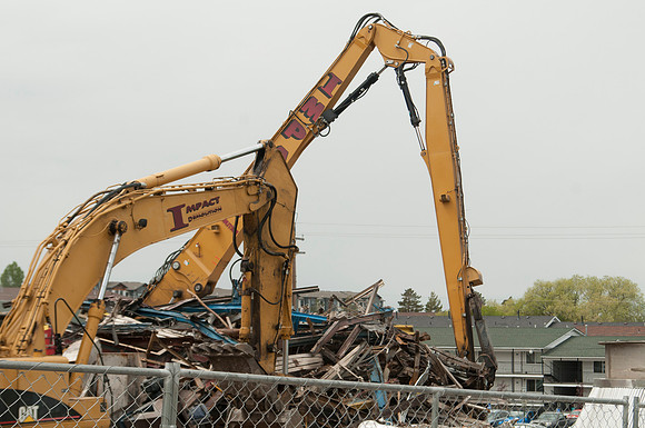 A construction crew continues to tear down the old heating plant.