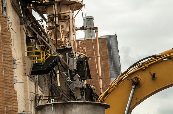 A construction crew continues to tear down the old heating plant.