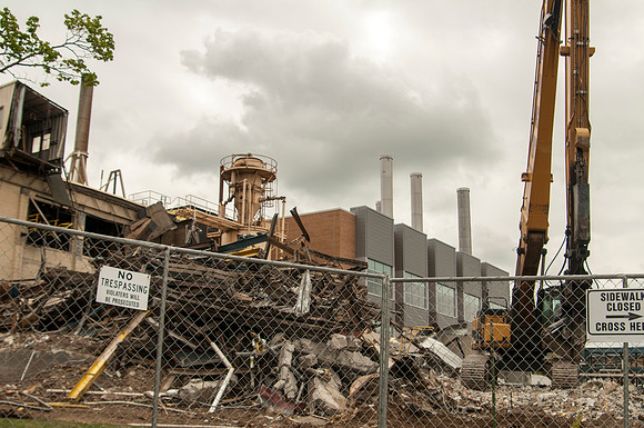 A construction crew continues to tear down the old heating plant.