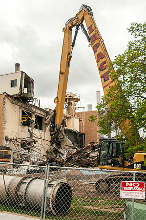 A construction crew continues to tear down the old heating plant.