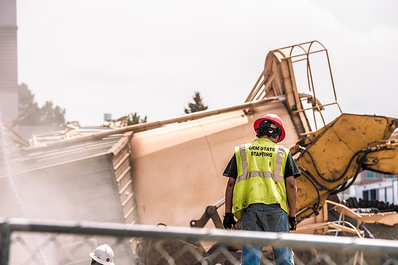 A construction crew continues to tear down the old heating plant.