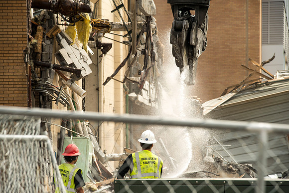 A construction crew continues to tear down the old heating plant.