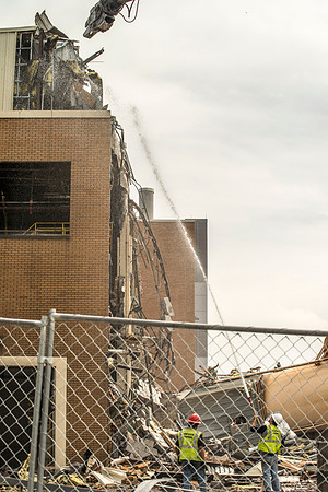 A construction crew continues to tear down the old heating plant.