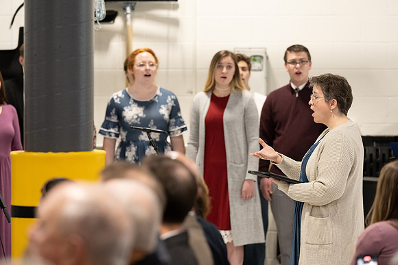 Dedication of the Engineering Technology Center, the Visual Arts Center and the University Village Community Center originated from the automotive shop in the ETC.