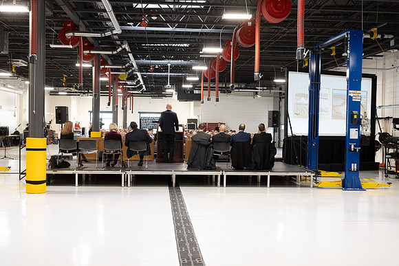 Dedication of the Engineering Technology Center, the Visual Arts Center and the University Village Community Center originated from the automotive shop in the ETC.