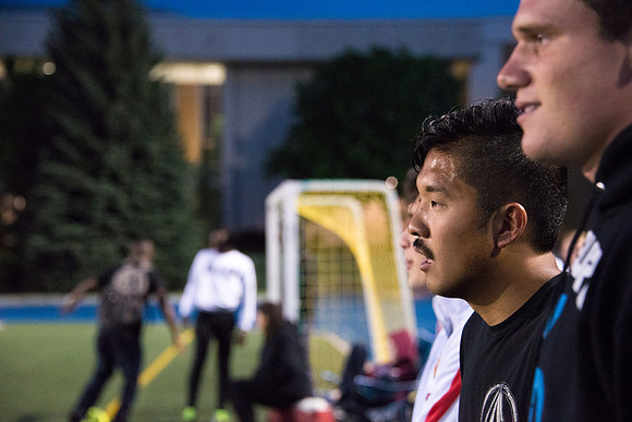 Students take a break during a rec soccer game.