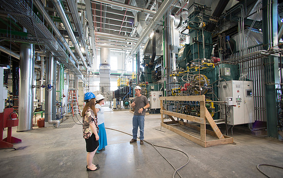 Construction management intern Matt Brower with copywriters, Jordon and Shelby in the new Heating Plant.