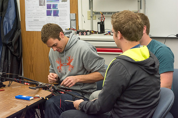 Engineering students test out the hexcopter they made.