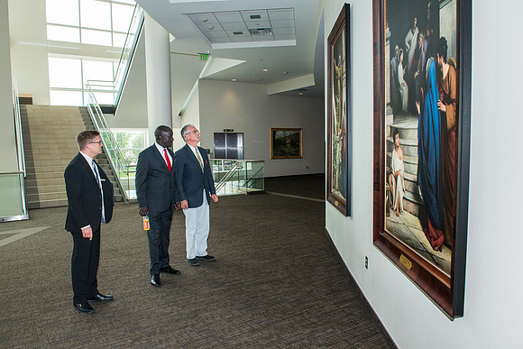 The Ugandan Minister of State for Relief, Disaster Preparedness and Refugees, enjoys a tour of BYU-Idaho, accompainie by David Pigott and Brett Sampson. His son is a student here at the University.