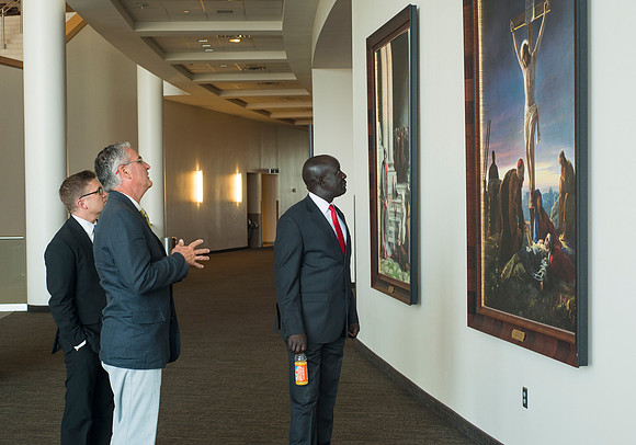 The Ugandan Minister of State for Relief, Disaster Preparedness and Refugees, enjoys a tour of BYU-Idaho, accompainie by David Pigott and Brett Sampson. His son is a student here at the University.